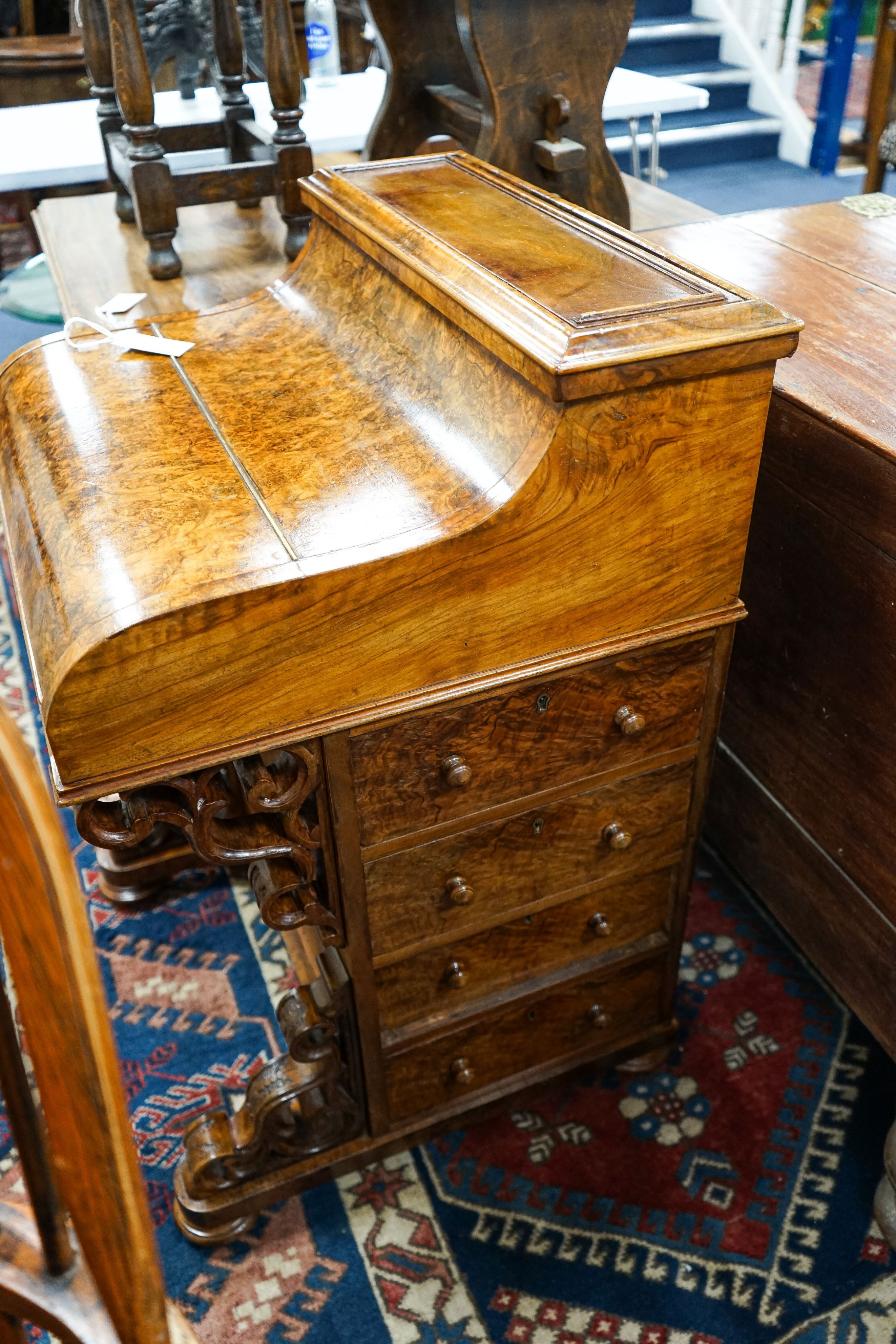 An Irish burr walnut piano top Davenport marked J J Byrne, 6 Henry Street, Dublin, width 56cm, depth 55cm, height 89cm